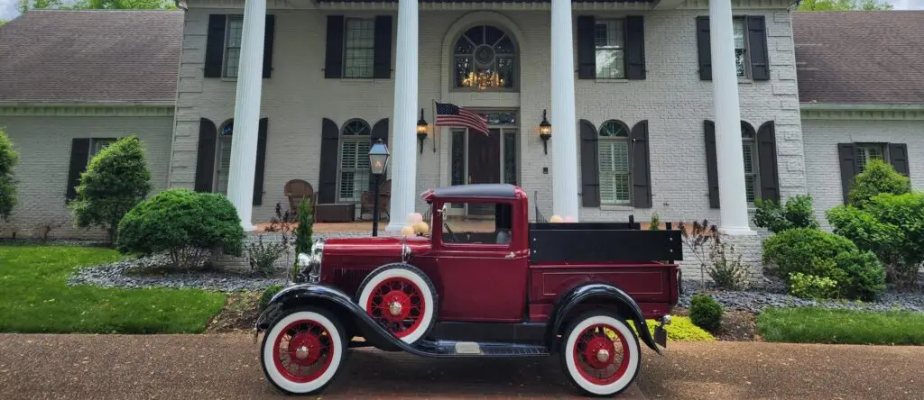 Classic truck in front of Treemont Mansion